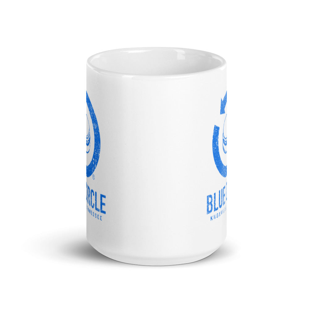 Blue Circle Arrow Logo White Glossy Mug by RICK BALDWIN
